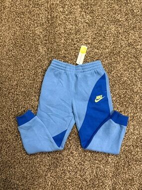 Nike Kids Light Blue and Royal Blue Colorblock Joggers with Yellow Logo